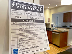 Energy Efficiency Citation hanging on a kitchen cabinet.