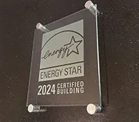 Glass plaque showing an etched ENERGY STAR logo and the words "2024 ENERGY STAR Certified Building"